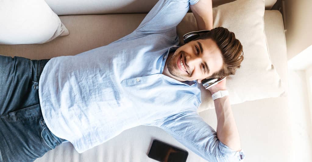 Man listening music at home